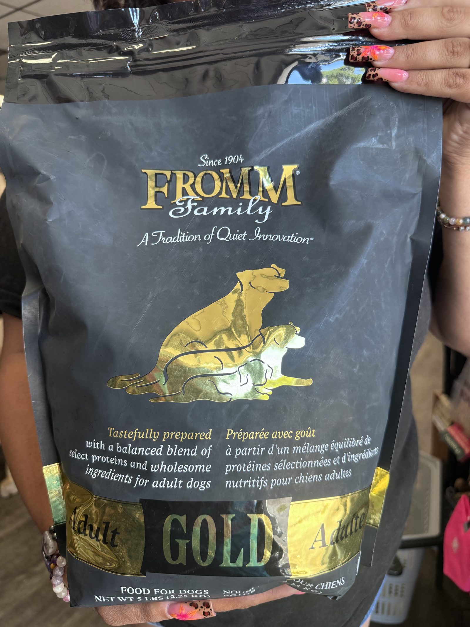 Holistic dog food held in hand at Earthwise Pet Mantua